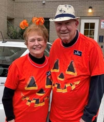 Couple in matching pumpkin costume